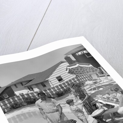 1950s Family In Backyard Beside Pool Having Cookout Of Hot Dogs and Hamburgers by Anonymous