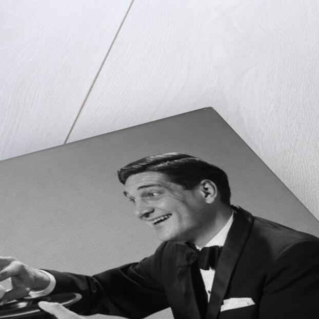 1960s Profile Magician Man Pulling 4 Eggs Out Of Hat Holding Them Between Fingers by Anonymous