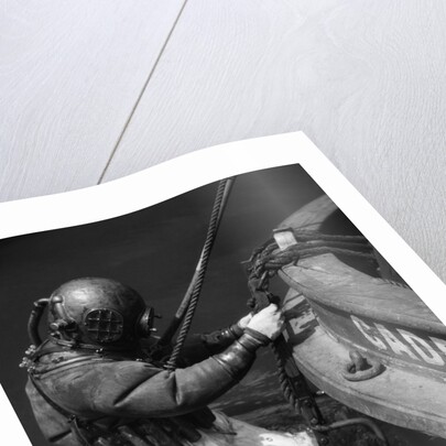 1930s Side View Of Diver In Pressure Suit Descending Into Water From Side Of Boat by Anonymous