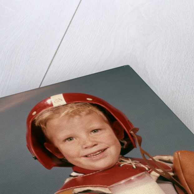 1960s Boy Wearing Red Helmet Football Shoulder Pads Holding Glass Milk and Football by Anonymous