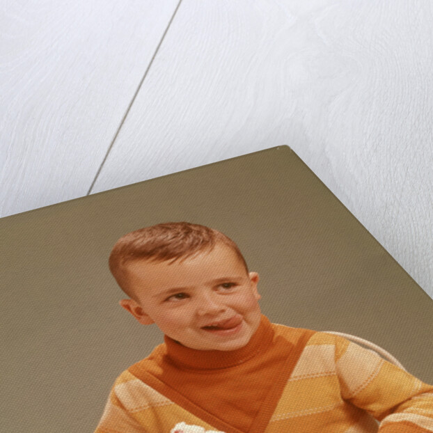 Boy Sitting At Ice Cream Parlor Table Eating Whipped Cream Cherry Topped Sundae+ by Anonymous