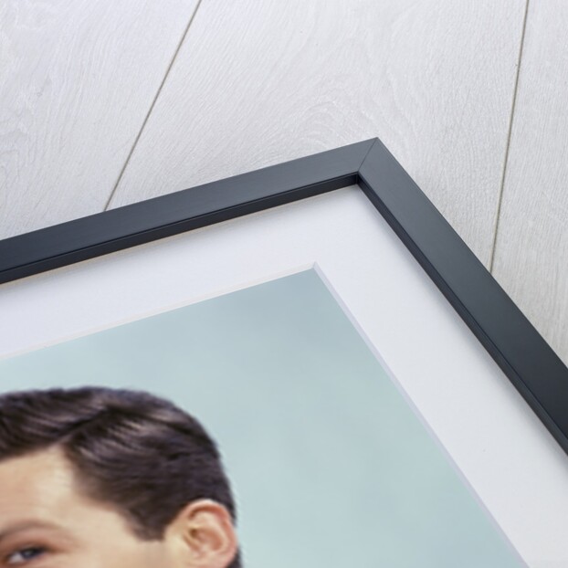 1960s Man Drinking Glass Water Wearing Red Checkered Shirt by Anonymous