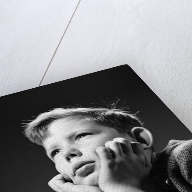 1940s Bored Serious Boy Waiting Chin Resting In Hands by Anonymous