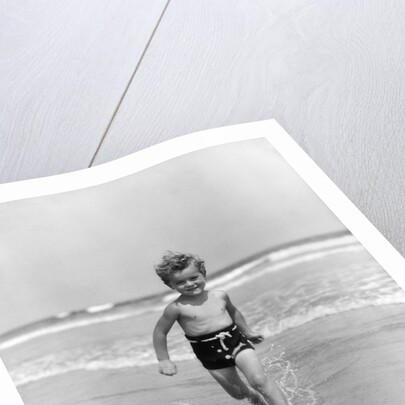 1930s Little Toddler Running In Surf by Anonymous