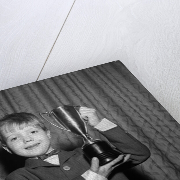 1950s Proud Boy Holding Up Trophy Award by Anonymous