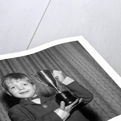 1950s Proud Boy Holding Up Trophy Award by Anonymous