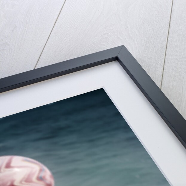1950s Woman Jumping In Surf Holding Up Beach Ball by Anonymous