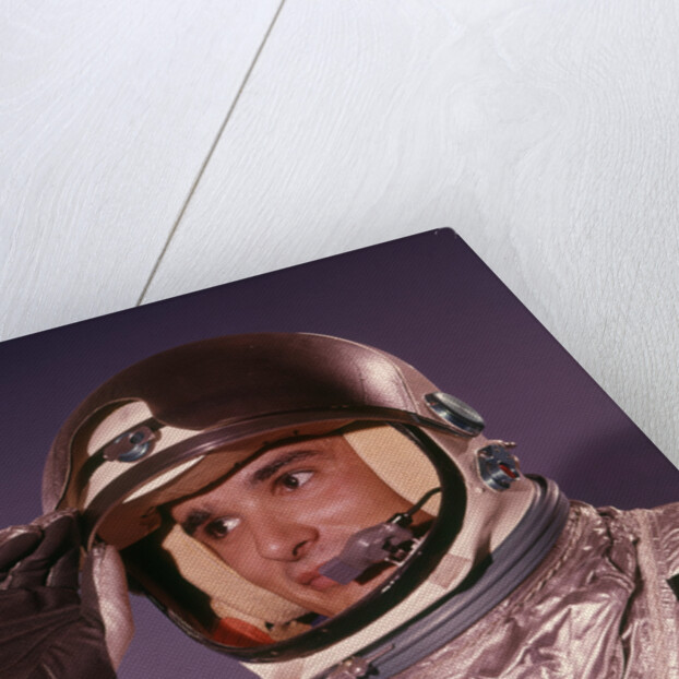 1960s Man Astronaut Lifting Up Visor Helmet Wearing Silver Navy Space Suit by Anonymous