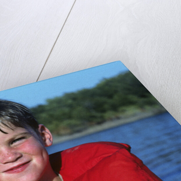 Young Boy Wearing Red Life Preserver by Anonymous