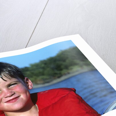 Young Boy Wearing Red Life Preserver by Anonymous