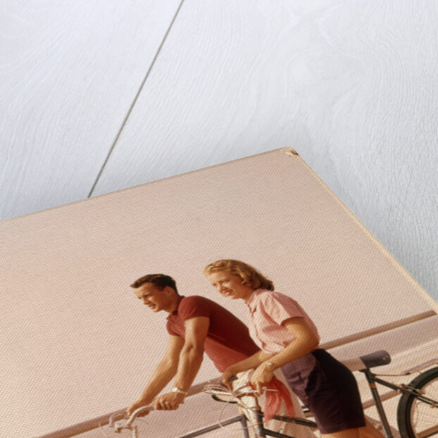 1950s 1960s Teen Couple Standing By Bikes On Beach Boardwalk by Anonymous