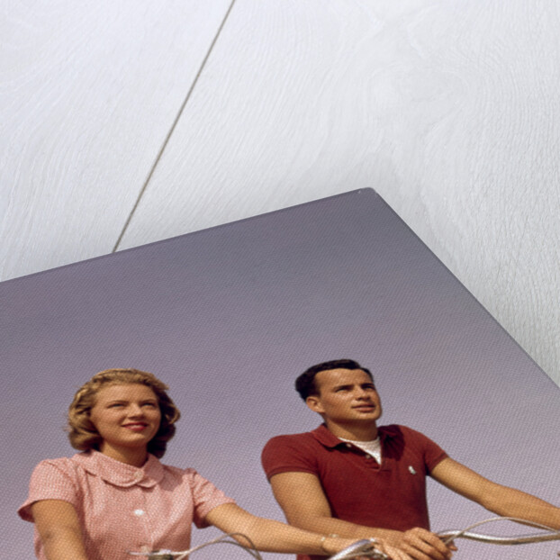 1950s 1960s Couple Man Woman Riding Bicycles Outdoors by Anonymous