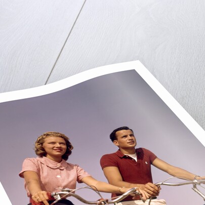 1950s 1960s Couple Man Woman Riding Bicycles Outdoors by Anonymous