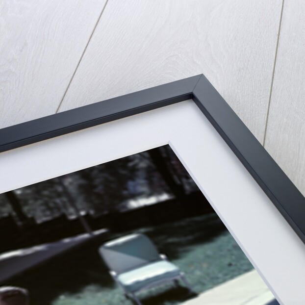 1950s Family In Backyard Having Picnic From Grill Near Swimming Pool by Anonymous