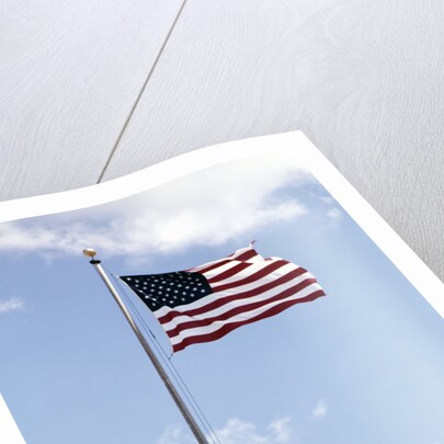 1960s American Flag On Pole Flying Against Blue Sky With Clouds by Anonymous