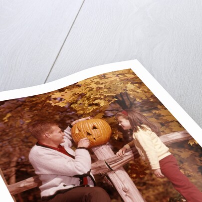1960s Man Father And Girl Daughter Carving Halloween Jack-O-Lantern Pumpkin by Anonymous
