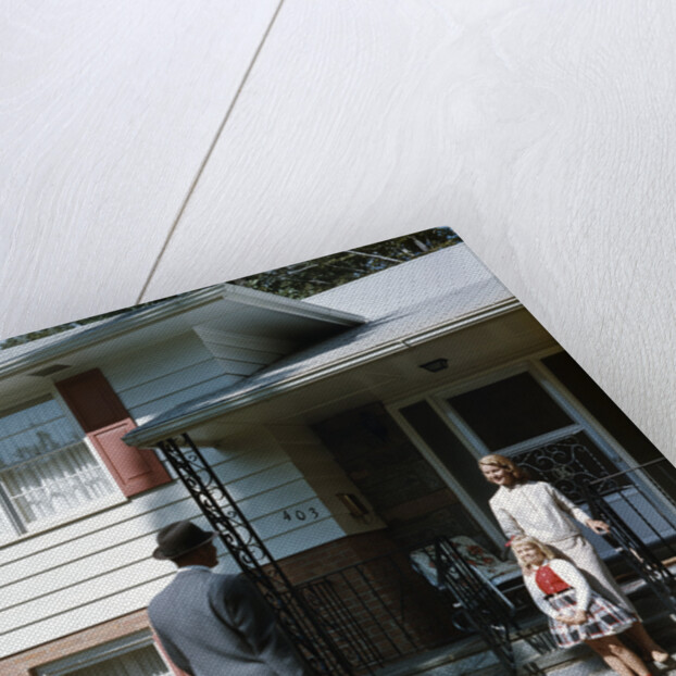 1950s Woman and Daughter Waiting At Front Steps For Man Coming Home by Anonymous