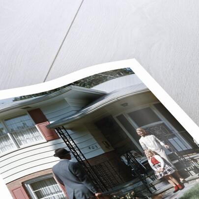 1950s Woman and Daughter Waiting At Front Steps For Man Coming Home by Anonymous