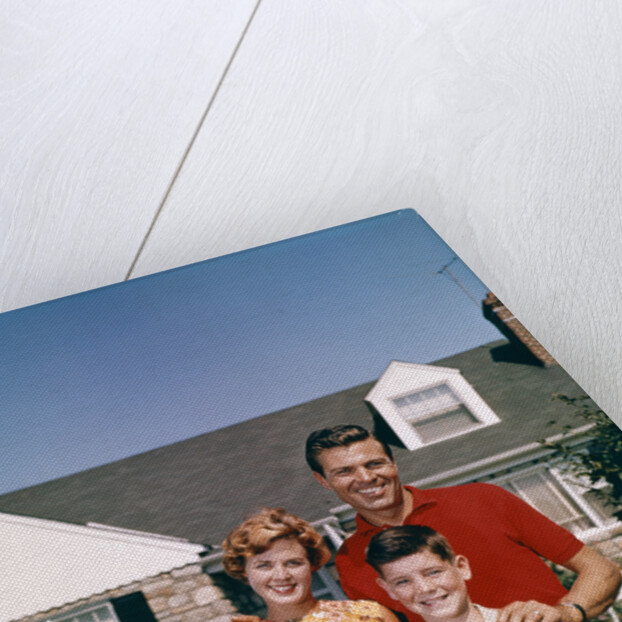 1960s Portrait Family Father Mother Two Sons Standing Together In Front Of Suburban House by Anonymous