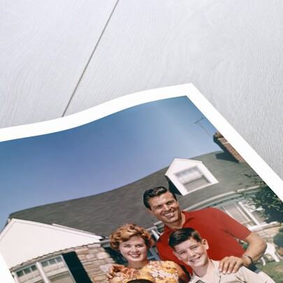 1960s Portrait Family Father Mother Two Sons Standing Together In Front Of Suburban House by Anonymous