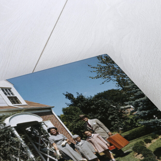 1940s 1950s Family Father Mother Daughter Son Leaving Suburban House Carrying Luggage by Anonymous