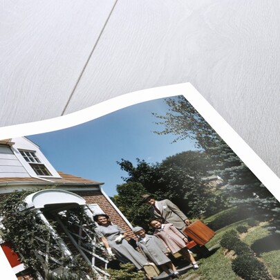 1940s 1950s Family Father Mother Daughter Son Leaving Suburban House Carrying Luggage by Anonymous