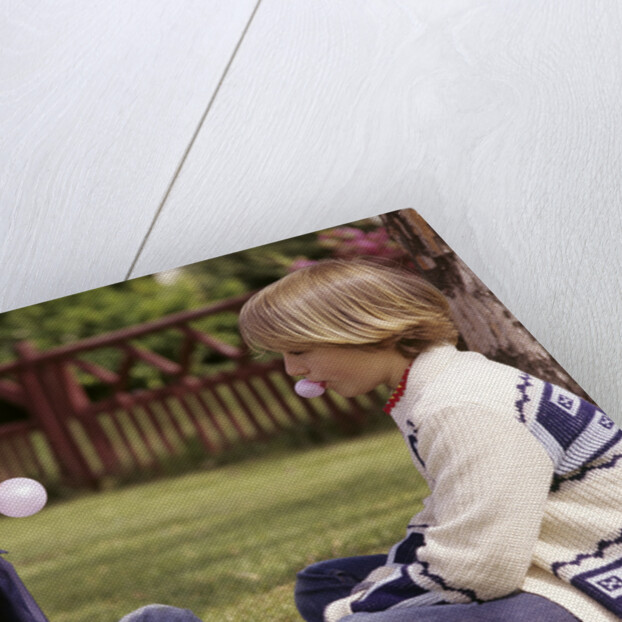 1970s Girls Sit Face To Face Blowing Pink Bubbles With Bubble Gum by Anonymous