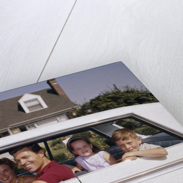 1960s Father And Mother With Son And Daughter Sitting In White Four Door Sedan Automobile by Anonymous