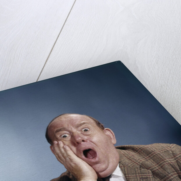 1960s Balding Businessman Holding Hand Up To Face Shocked Expression Eyes Bulging Mouth Open by Anonymous