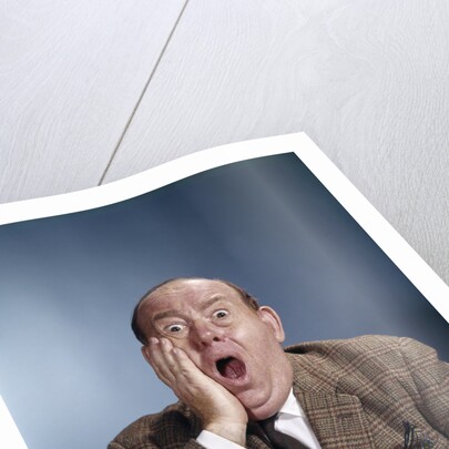 1960s Balding Businessman Holding Hand Up To Face Shocked Expression Eyes Bulging Mouth Open by Anonymous
