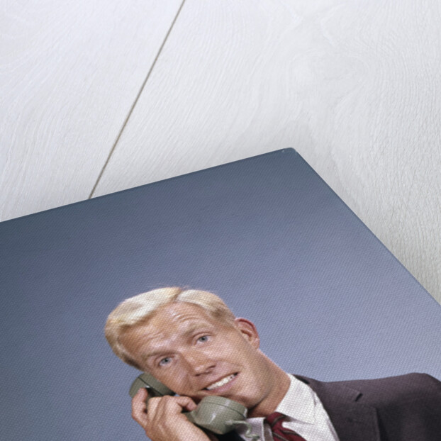 1960s Young Businessman Salesman Talking On Telephone by Anonymous