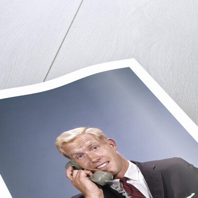 1960s Young Businessman Salesman Talking On Telephone by Anonymous