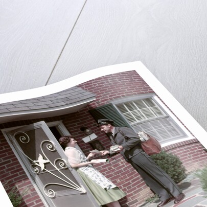 1950s Mailman Delivering Mail To Woman Brick Suburban Home by Anonymous