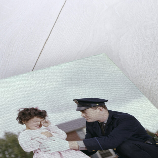 1960s Man Police Officer Comforting Crying Scared Little Lost Girl In Suburban Neighborhood by Anonymous