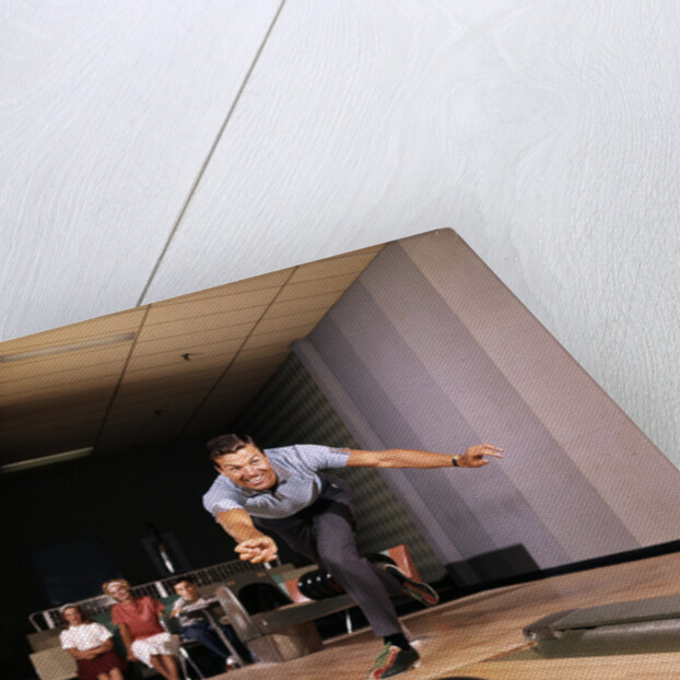 1960s Man In Good Form Releasing Bowling Ball Down Lane Wife Woman 2 Kids Behind Him by Anonymous