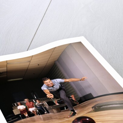 1960s Man In Good Form Releasing Bowling Ball Down Lane Wife Woman 2 Kids Behind Him by Anonymous