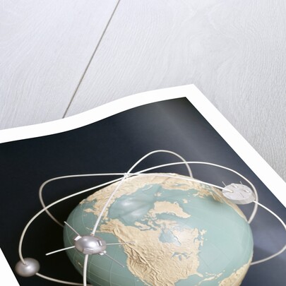 1950s 1960s Model Of Satellites Orbiting The Globe by Anonymous