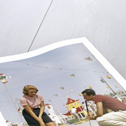 1950s 1960s Young Couple Man Woman Play Miniature Golf Summer Amusement by Anonymous