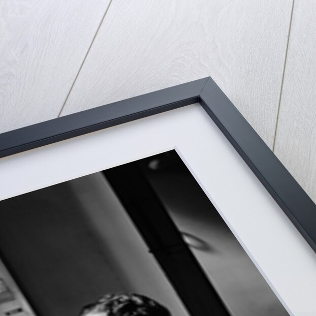 1930s 1940s Woman Scientist In Lab Coat Holding Up And Examining Beaker Of Liquid by Anonymous