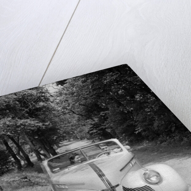 1940s 1941 Couple Man And Woman In Pontiac Convertible Driving On Country Lane In Countryside by Anonymous