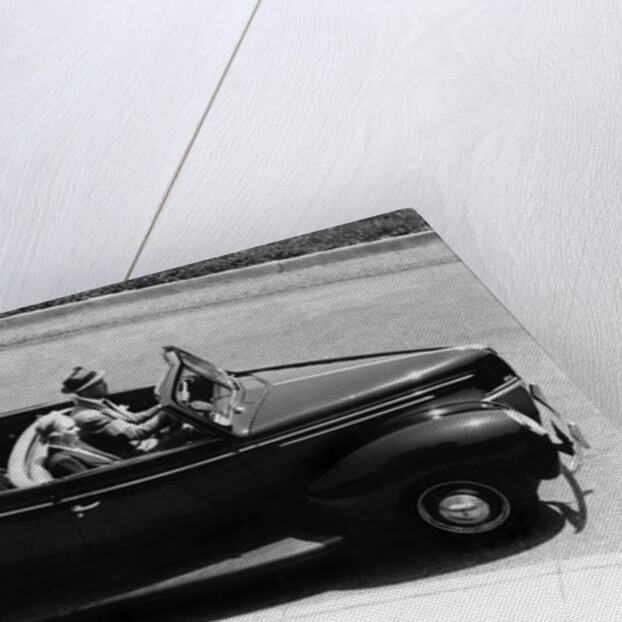 1930s 1940s Couple Driving 1938 Convertible Four Door Sedan Automobile With Luggage In Back Seat by Anonymous