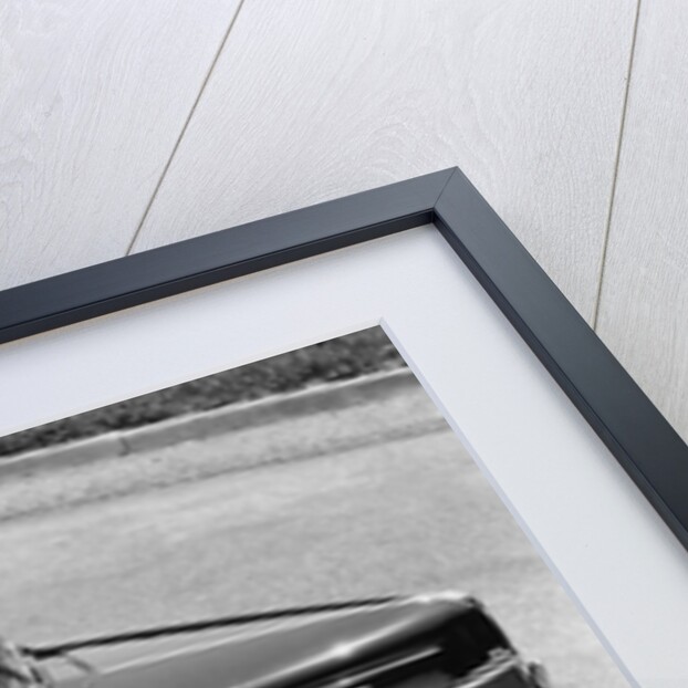 1930s 1940s Couple Driving 1938 Convertible Four Door Sedan Automobile With Luggage In Back Seat by Anonymous