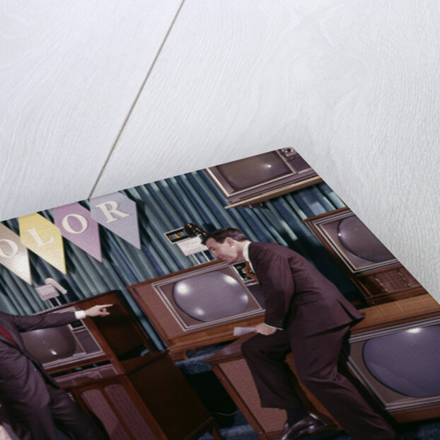 1960s Couple Man Woman Talking To Salesman In Color Television Set Sales Department by Anonymous