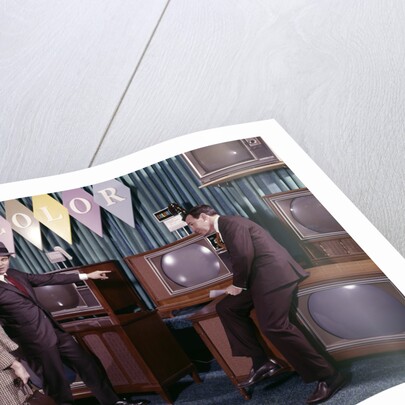 1960s Couple Man Woman Talking To Salesman In Color Television Set Sales Department by Anonymous