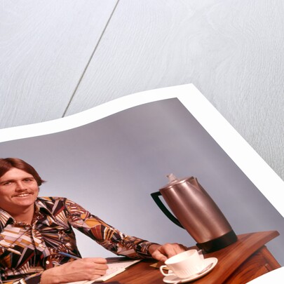 1970s Young Man Mustache Loud Print Shirt Desk Empty Coffee Cup Pot Family Budget by Anonymous