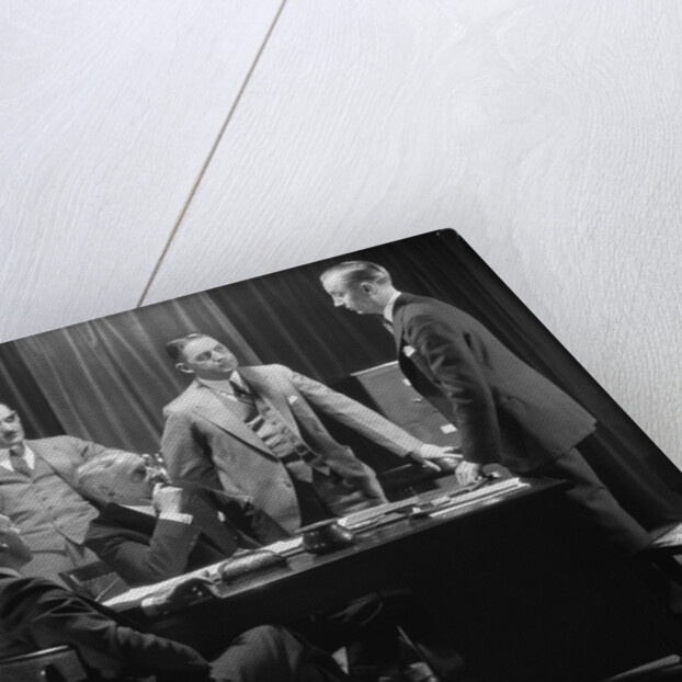 1930s Five Older Businessmen Meeting Around A Desk Listening To A Sixth Younger Man Speak by Anonymous