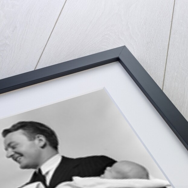 1930s 1940s Woman Nurse Talking With Man Proud New Father Holding Newborn Twin Babies by Anonymous