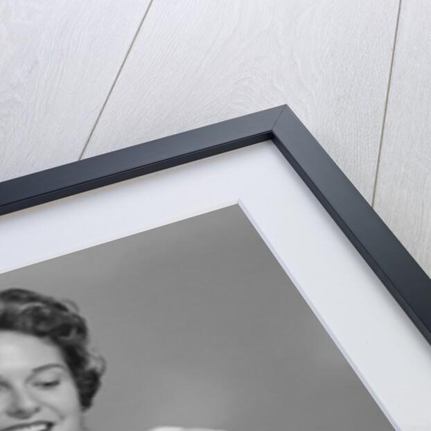 1950s 1960s Man New Father Looking At Baby Held By Woman Nurse by Anonymous