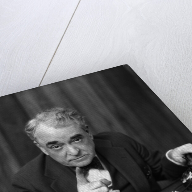 1930s Head-On Serious Senior Businessman Behind Desk Hand On Telephone Pointing by Anonymous