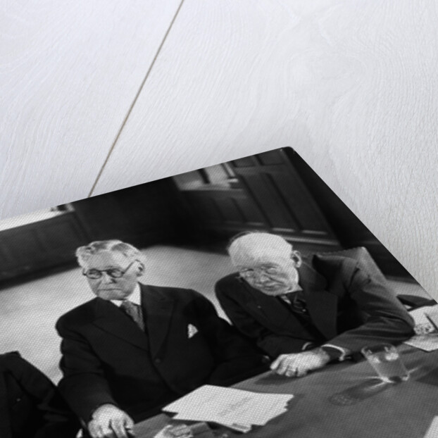 1930s 1940s Elderly Businessmen Sitting At Conference Table With Attention Directed To Speaker Not Shown by Anonymous